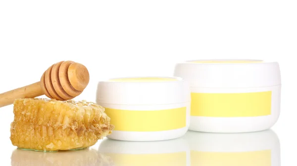 Jars of cream with honey isolated on white — Stock Photo, Image