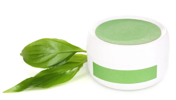 Jar of cream with green leaves isolated on white — Stock Photo, Image
