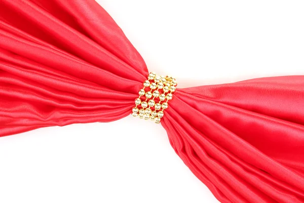 Red cloth tied with beads isolated on white — Stock Photo, Image