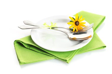 Spoon, fork and flower on plate, isolated on white clipart