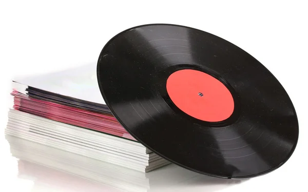 Svart vinyl record och bunt med tidningar isolerad på vit — Stockfoto