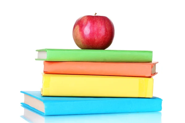 Composição de livros escolares e uma maçã isolada em branco — Fotografia de Stock