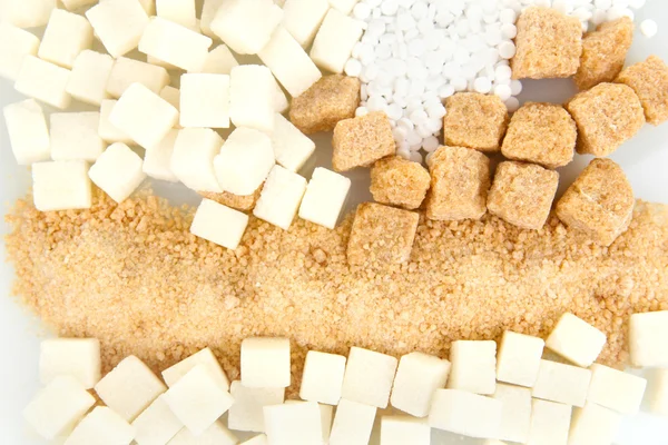 Edulcorante con azúcar blanca y morena de cerca —  Fotos de Stock