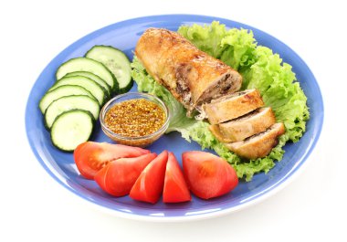 Tasty meat cutlet with garnish on plate isolated on white