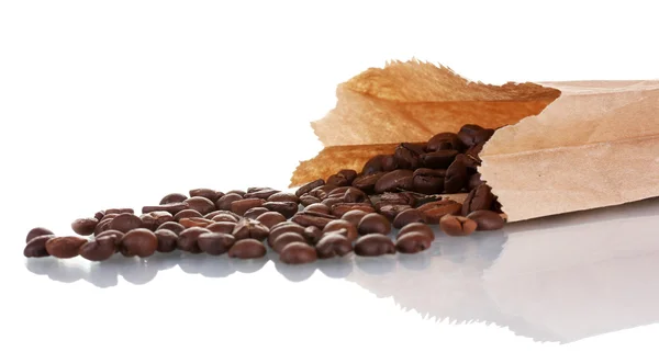 Coffee beans is poured from a paper bag isolated on white — Stock Photo, Image