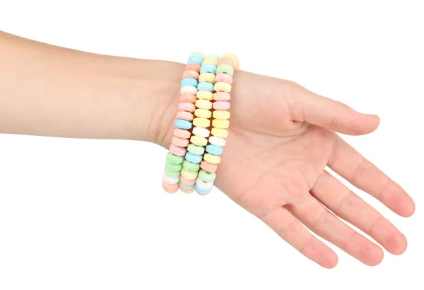 Цветные конфеты на руке изолированы на белом — стоковое фото