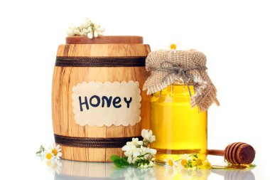 Sweet honey in barrel and jar with acacia flowers isolated on white clipart