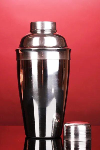 Cocktail shaker on red background — Stock Photo, Image