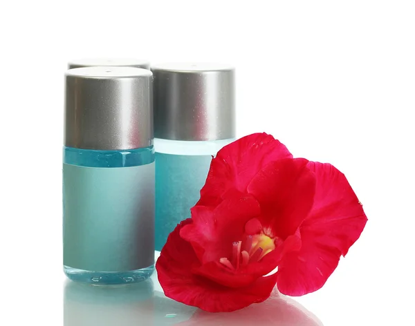 Cosmetic bottles and flower, isolated on white — Stock Photo, Image