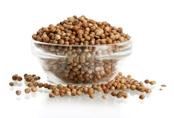 Heap coriander seeds in glass bowl isolated on white — Stock Photo, Image