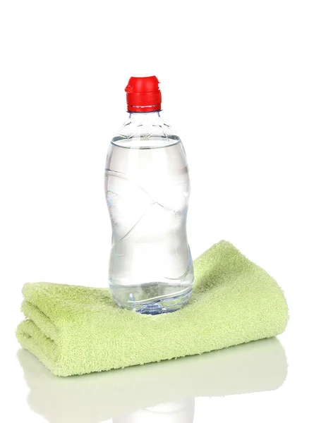 Plastic bottle of water on towel isolated on white — Stock Photo, Image