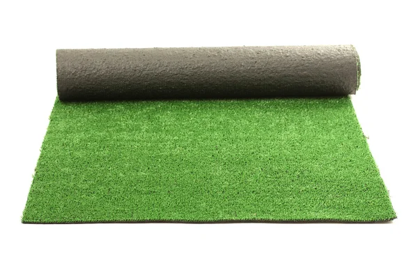 Kunstigt rullet grønt græs, isoleret på hvidt - Stock-foto