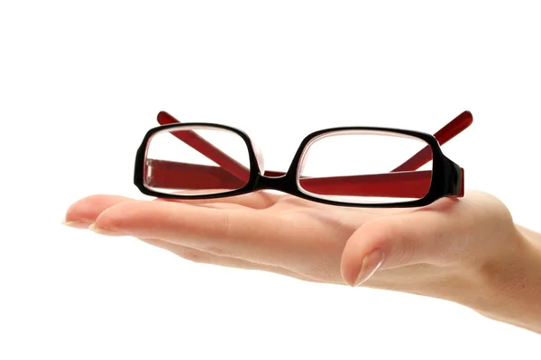 Óculos na mão feminina, isolados em branco — Fotografia de Stock