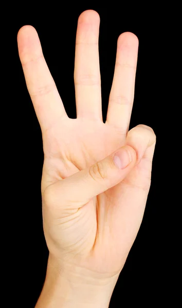 Ręka, co znak na czarnym tle — Zdjęcie stockowe