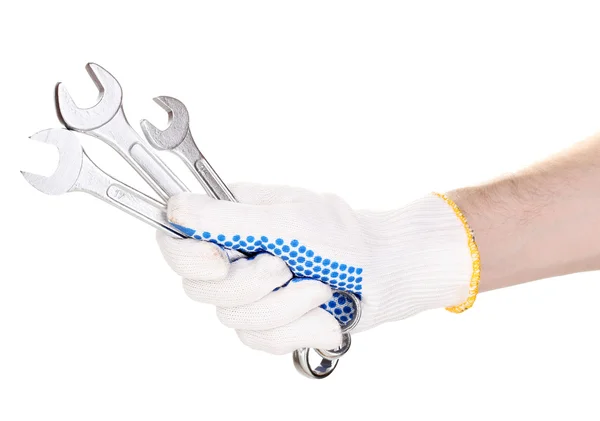 Moersleutels in de hand met bescherming handschoen geïsoleerd op wit — Stockfoto