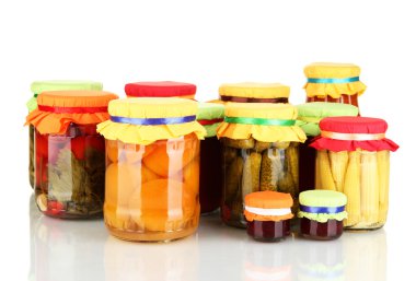 Jars with canned fruits and vegetables isolated on white clipart