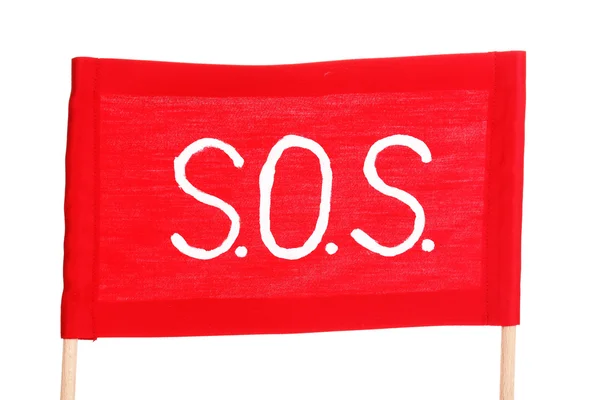 SOS sinal escrito em pano vermelho isolado em branco — Fotografia de Stock