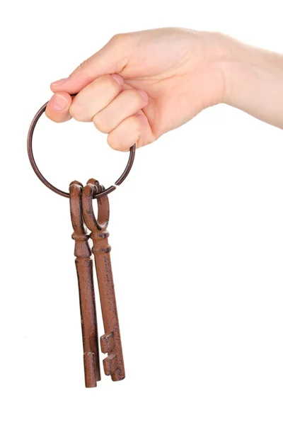 Ženská ruka držící svazek antické klíčů na bílém pozadí — Stock fotografie