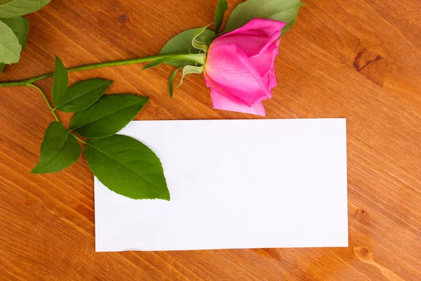 Beautiful rose on wooden background — Stock Photo, Image