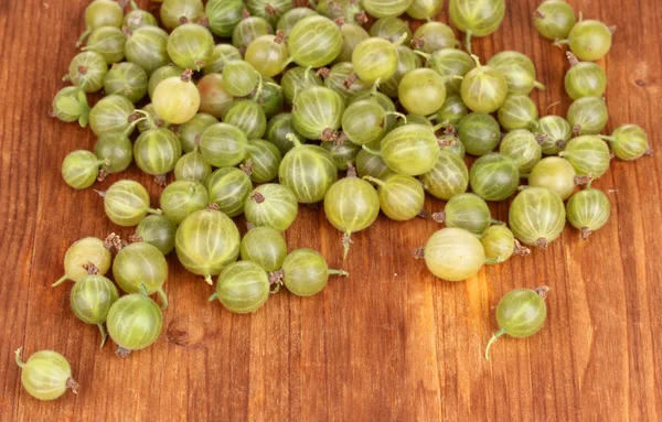 Green gooseberry on wooden background — Stock Photo, Image