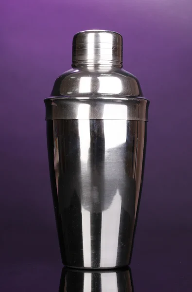 Cocktail shaker on violet background — Stock Photo, Image