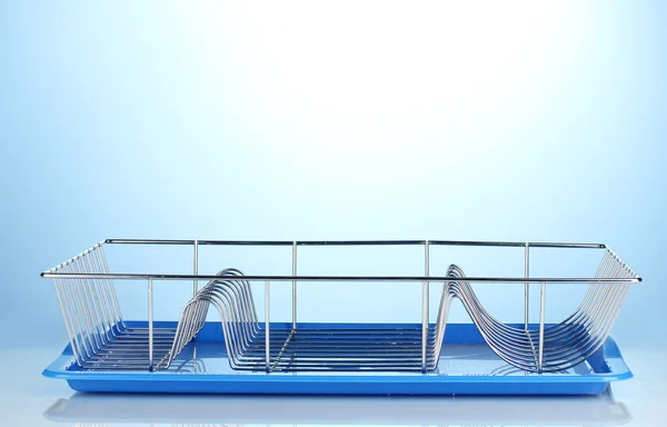 Draining board on blue background — Stock Photo, Image