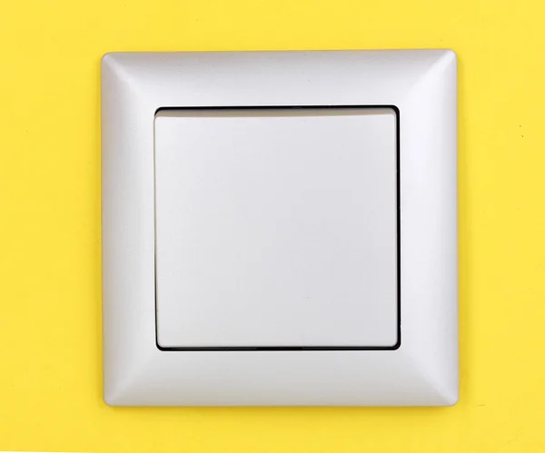Moderní světelný spínač na žlutém podkladu — Stock fotografie