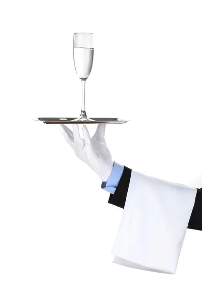 Garçom formal com um copo de água em bandeja de prata isolado em branco — Fotografia de Stock