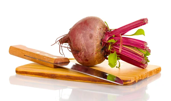 Young red beet on wooden board isolated on white — Stock Photo, Image