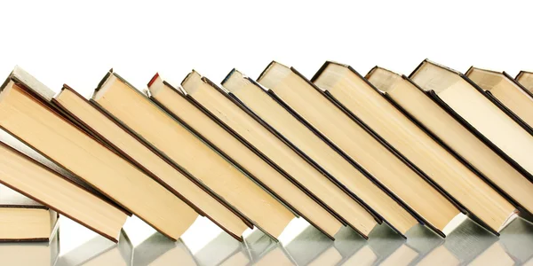 Leaning stack of books on white background — Stock Photo, Image