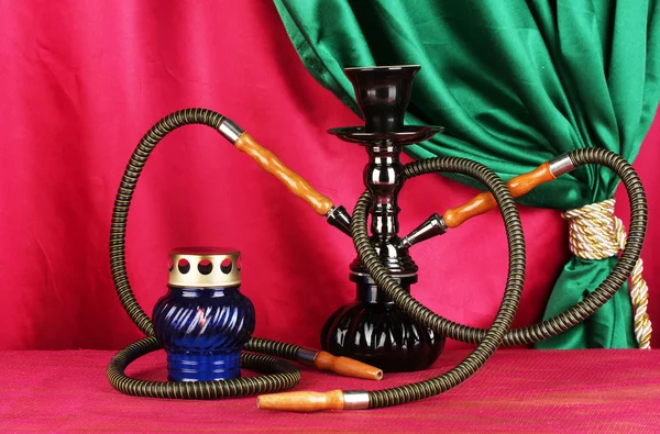 Hookah on a wooden table on a background of curtain close-up — Stock Photo, Image