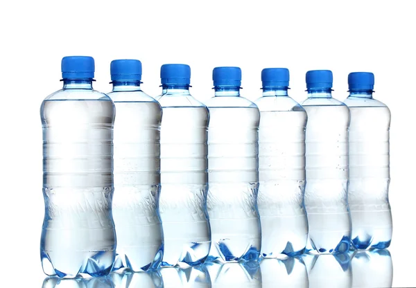 Plastic bottles of water isolated on white — Stok fotoğraf