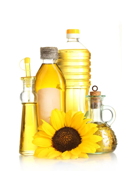 Olej ve sklenicích a slunečnice, izolované na bílém — Stock fotografie