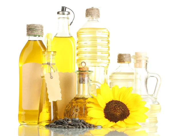 Olej w butelkach, słonecznik i nasiona, na białym tle — Zdjęcie stockowe