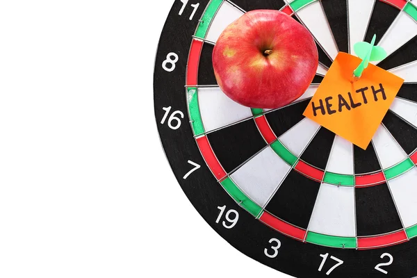 Darts with a sticker symbolizing health close-up on white background — Stock Photo, Image