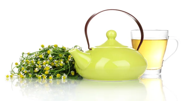 stock image Teapot and cup with chamomile tea isolated on white