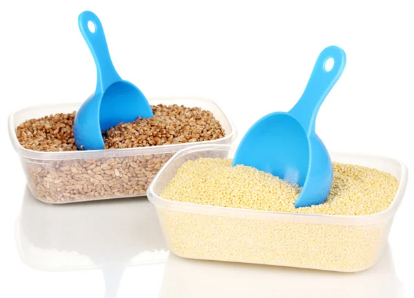 Measuring spoons and plastic containers with grain isolated on white — Stock Photo, Image