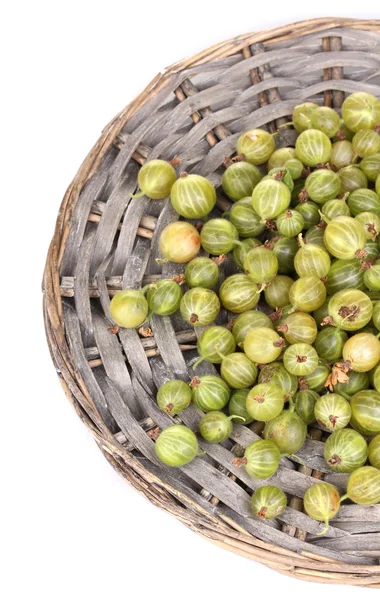 Green gooseberry on wicker mat isolated on white — Stock Photo, Image