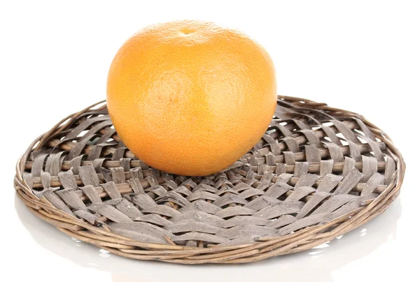 Ripe grapefruit on wicker mat isolated on white — Stock Photo, Image