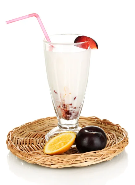 Delicious milk shake with fruit on wicker cradle isolated on white — Stock Photo, Image