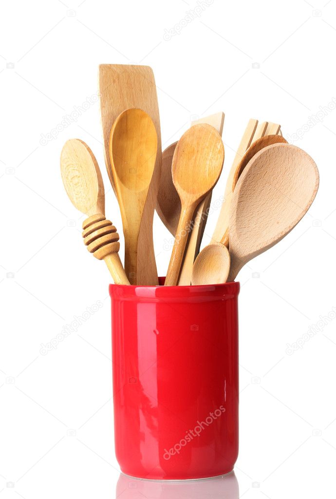 Wooden kitchen utensils in cup isolated on white