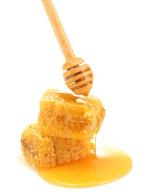 Golden honeycombs and wooden drizzler with honey isolated on white clipart