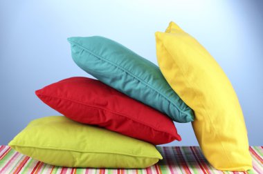 Pillows on blue background clipart