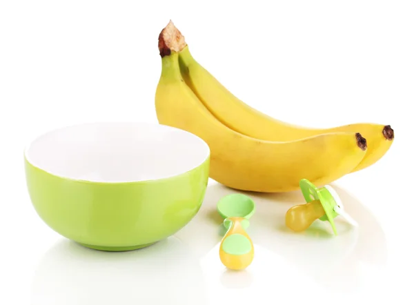 Płyta dziecka i łyżka z bananów i dziecko jest obojętne na białym tle — Zdjęcie stockowe