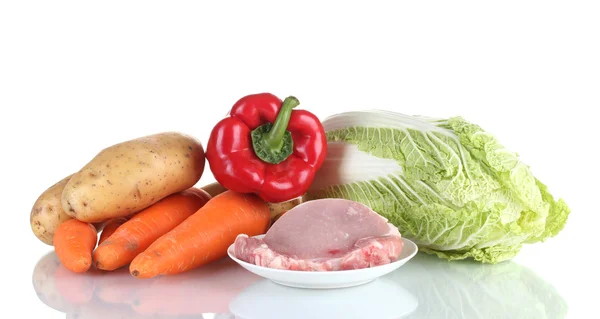 Fresh vegetables and pork steak isolated on white — Stock Photo, Image