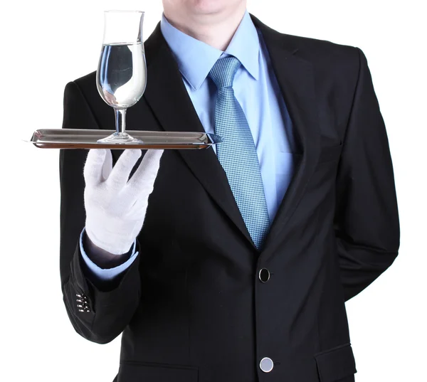 Camarero formal con un vaso de agua en bandeja de plata aislada en blanco — Foto de Stock