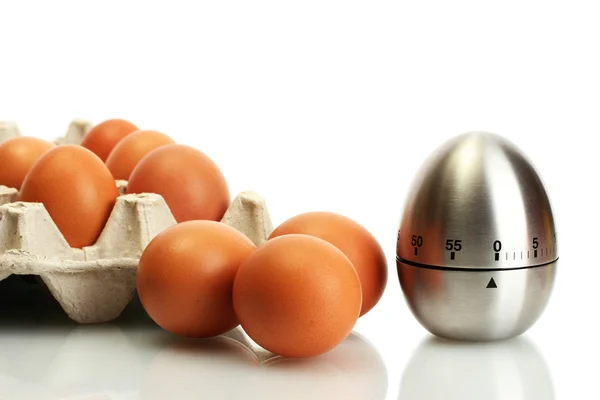 Huevos en caja y temporizador de huevo aislado en blanco — Foto de Stock