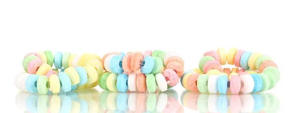 Renkli şekerleri üzerine beyaz izole ip üzerinde — Stok fotoğraf