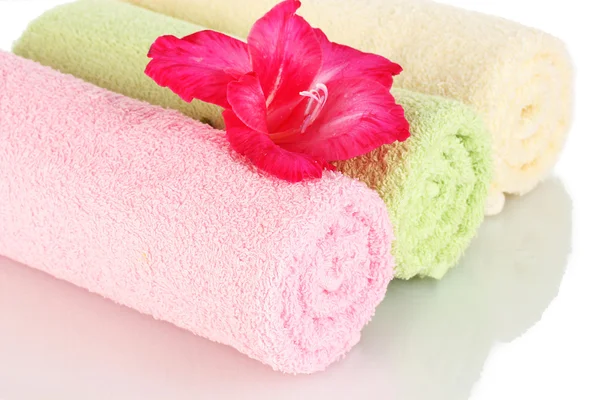 Bright towels and flower isolated on white — Stock Photo, Image