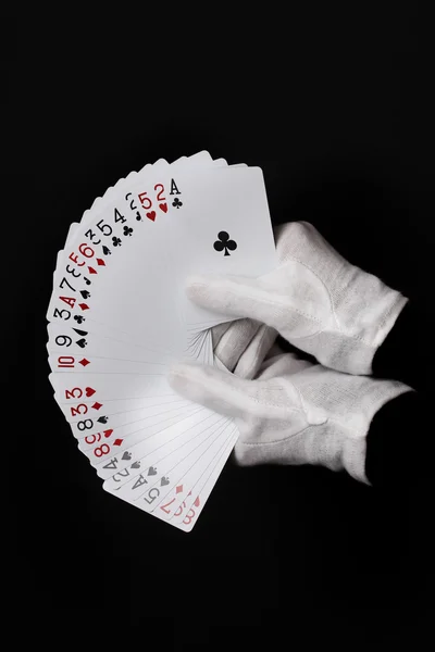 Cartões em mãos isoladas em preto — Fotografia de Stock